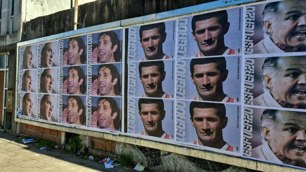 Ciudad repleta de afiches y rebranding